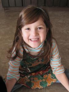 Casey wearing one of THOSE Christmas aprons before cookie baking in 2012.